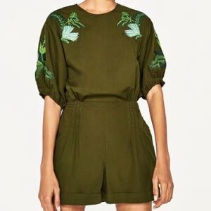 Olive green embroidered romper with tie waist, puff short sleeves and open back